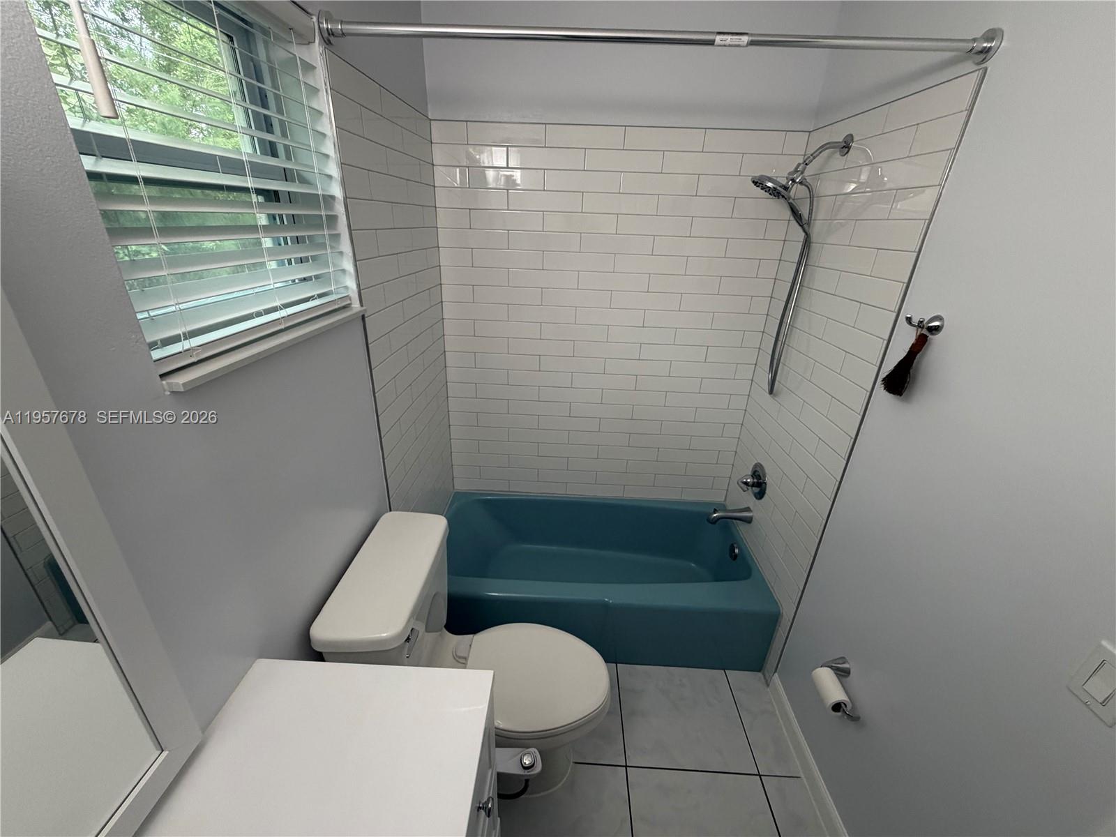 1301 North 12th Court, Unit 4B Hollywood, FL 33019 - Photo 19 of 27 a bathroom with a sink a toilet and shower