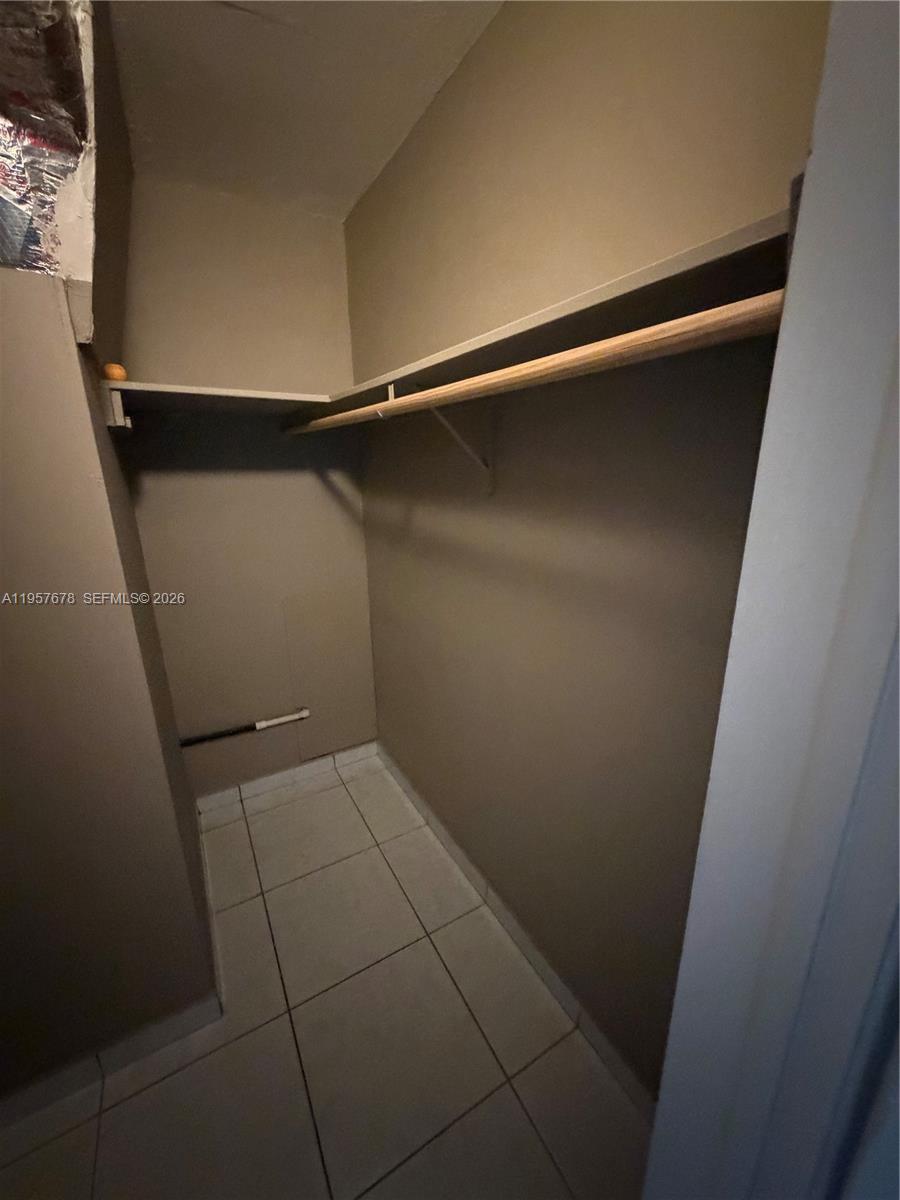 1301 North 12th Court, Unit 4B Hollywood, FL 33019 - Photo 22 of 27 a view of an empty walk in closet