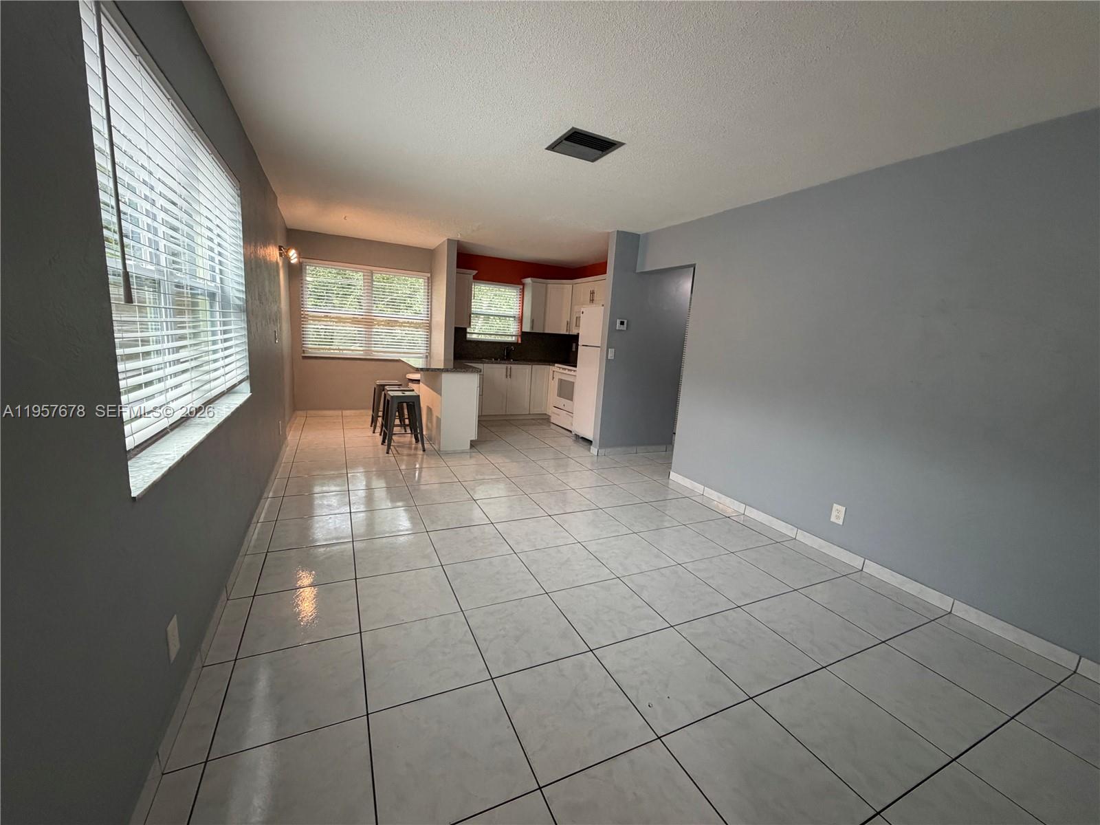 1301 North 12th Court, Unit 4B Hollywood, FL 33019 - Photo 7 of 27 a view of an empty room with a window
