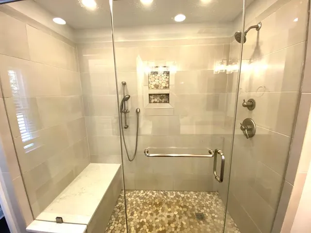 a bathroom with a shower and a toilet