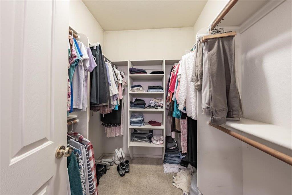 3159 Cedar Creek Lane Madera, CA 93637 - Photo 14 of 37 a view of walk in closet with clothes