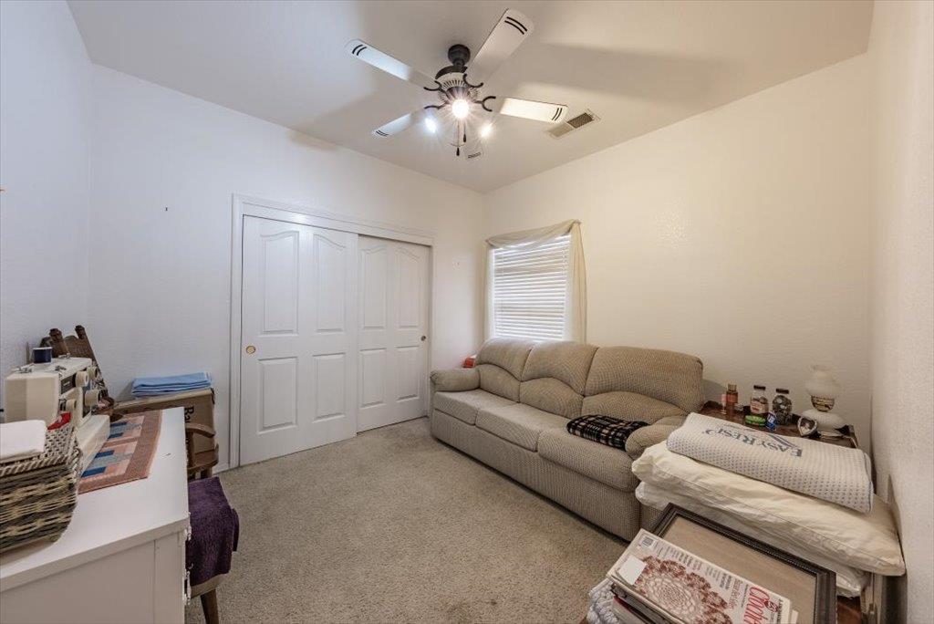 3159 Cedar Creek Lane Madera, CA 93637 - Photo 18 of 37 a living room with furniture and a chandelier
