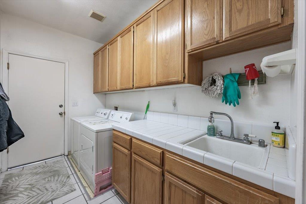 3159 Cedar Creek Lane Madera, CA 93637 - Photo 20 of 37 a view of a sink and cabinets