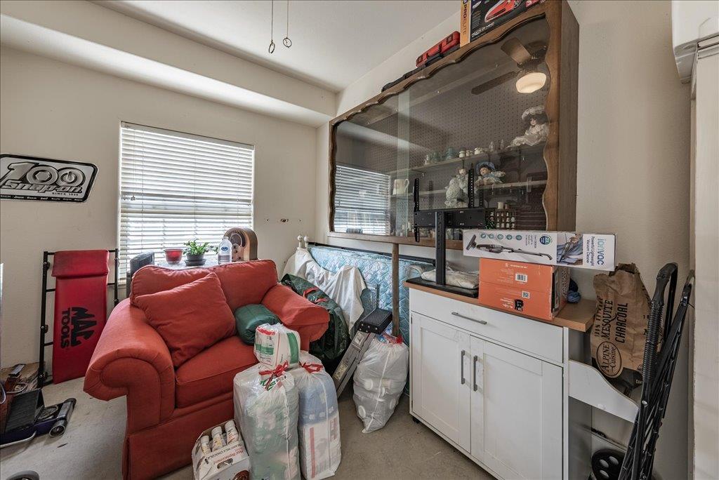 3159 Cedar Creek Lane Madera, CA 93637 - Photo 24 of 37 a living room filled with furniture and a window