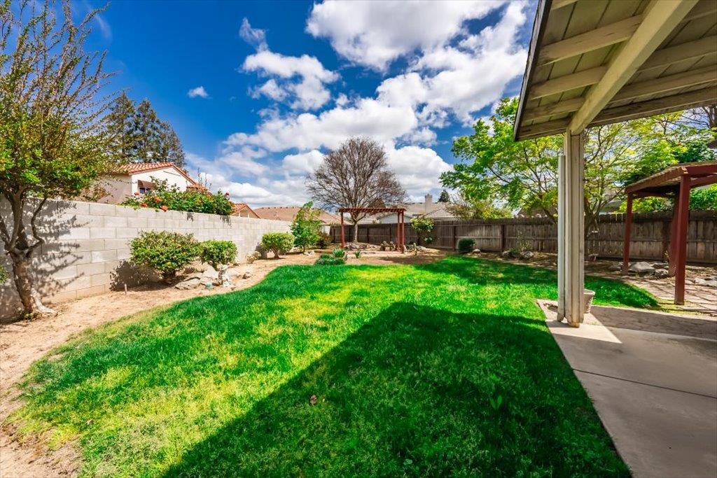 3159 Cedar Creek Lane Madera, CA 93637 - Photo 26 of 37 a view of a porch with a yard