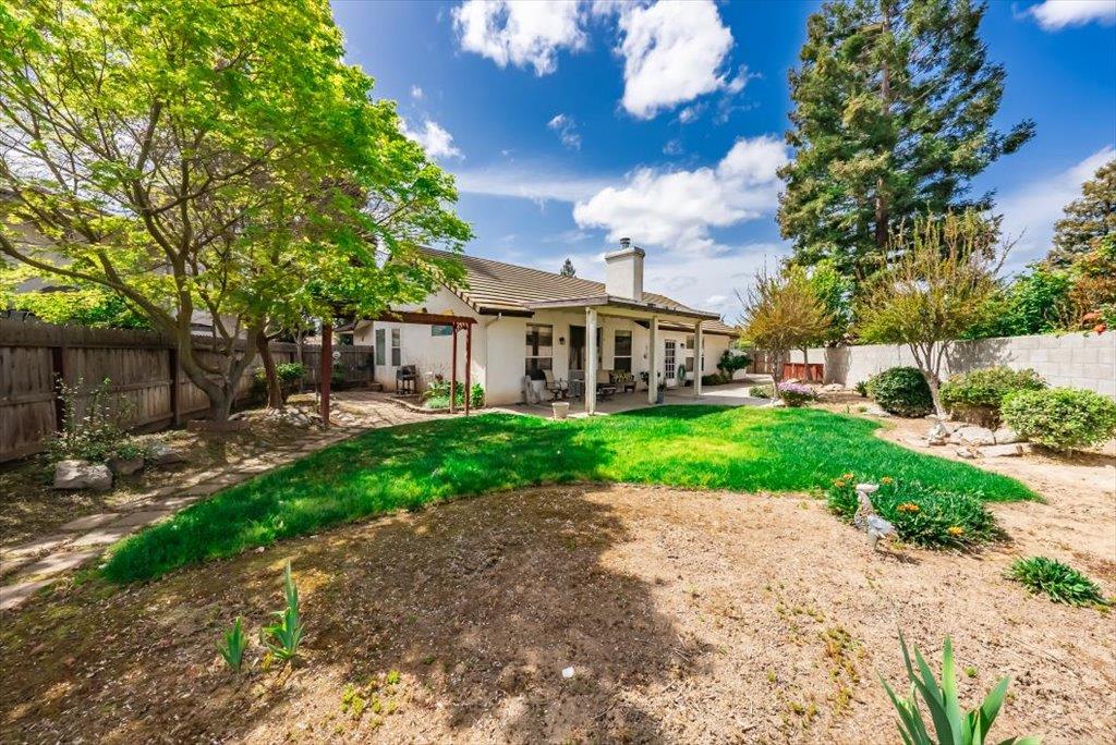 3159 Cedar Creek Lane Madera, CA 93637 - Photo 28 of 37 a view of a front of house with a yard