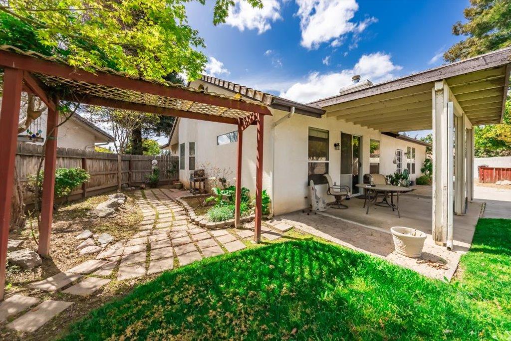 3159 Cedar Creek Lane Madera, CA 93637 - Photo 29 of 37 a view of a backyard with a patio