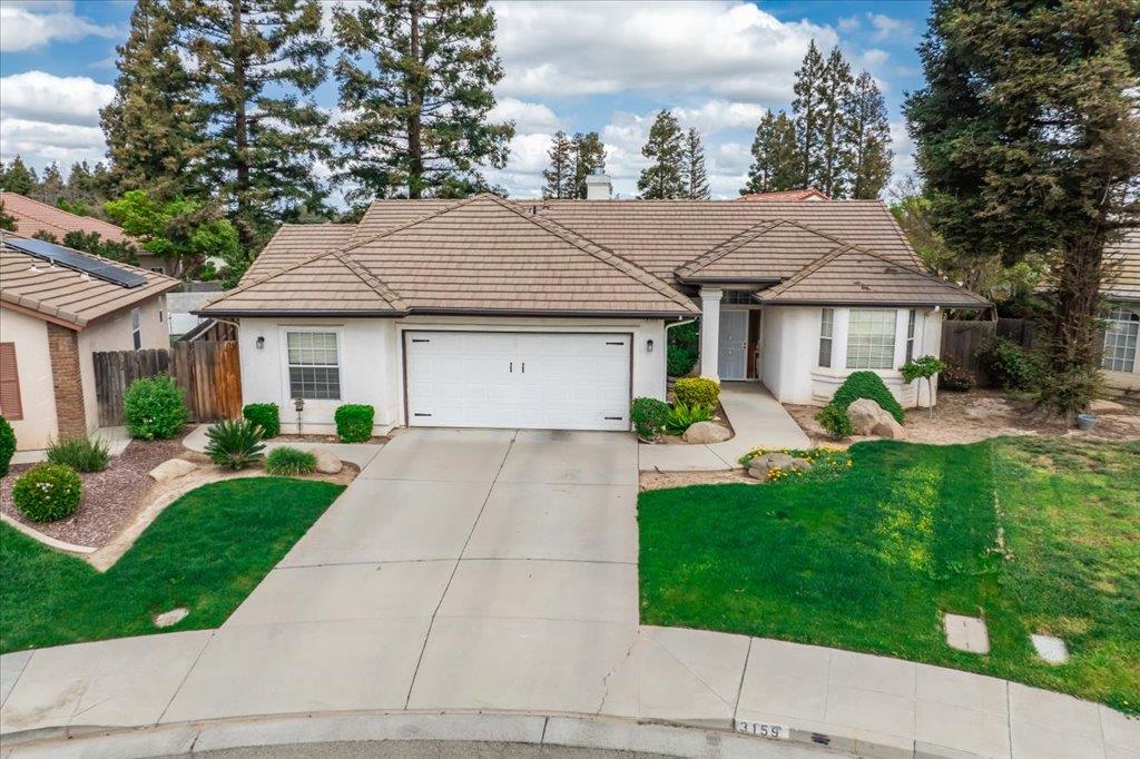 3159 Cedar Creek Lane Madera, CA 93637 - Photo 33 of 37 a front view of a house with garden