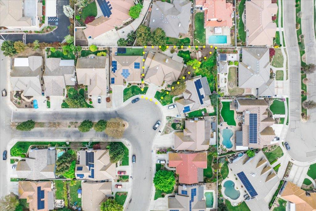 3159 Cedar Creek Lane Madera, CA 93637 - Photo 36 of 37 an aerial view of multiple houses with outdoor space