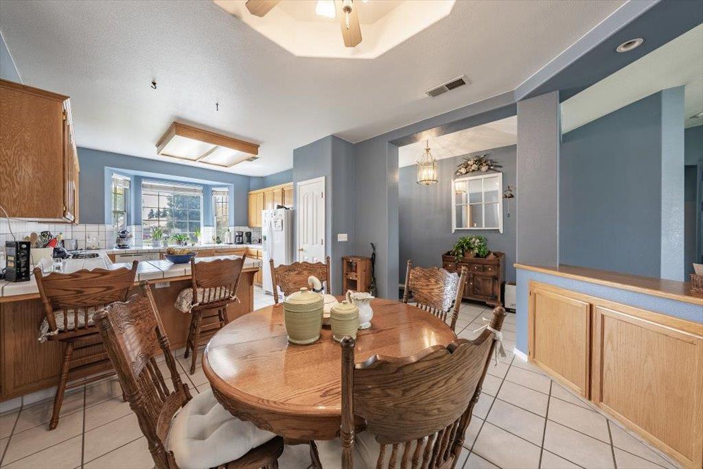 3159 Cedar Creek Lane Madera, CA 93637 - Photo 6 of 37 a view of a dining room with furniture