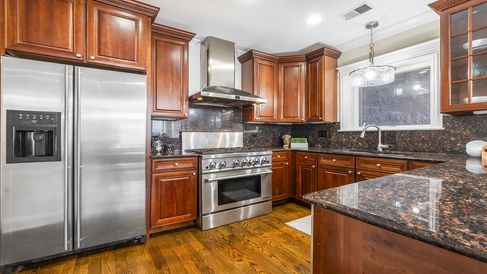 912 West Fletcher Street, Unit 2 Chicago, IL 60657 - Photo 12 of 29 a kitchen with stainless steel appliances granite countertop a stove a sink and a refrigerator