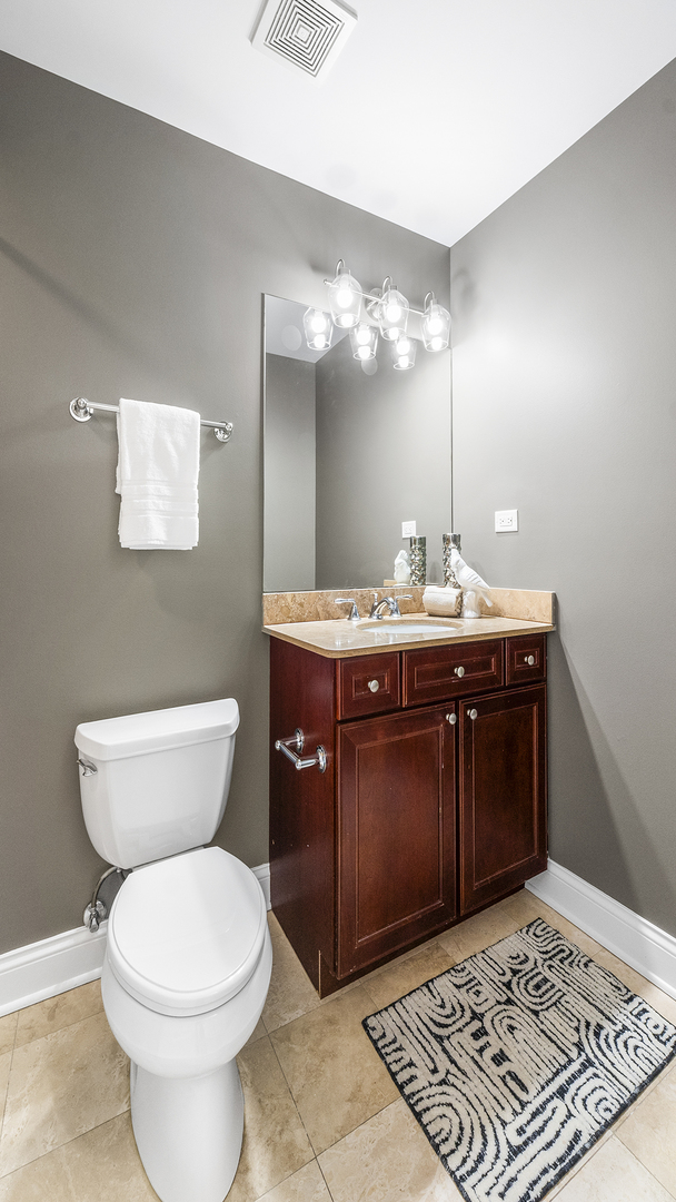 912 West Fletcher Street, Unit 2 Chicago, IL 60657 - Photo 19 of 29 a bathroom with a sink and a toilet