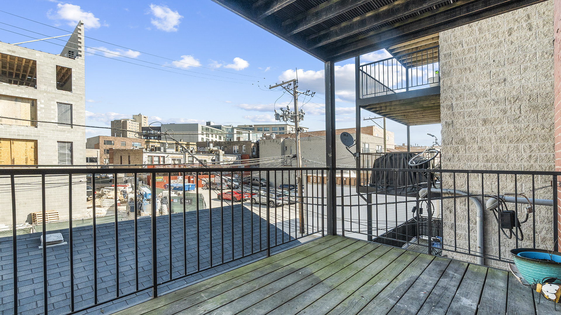 912 West Fletcher Street, Unit 2 Chicago, IL 60657 - Photo 26 of 29 a view of a balcony with wooden floor