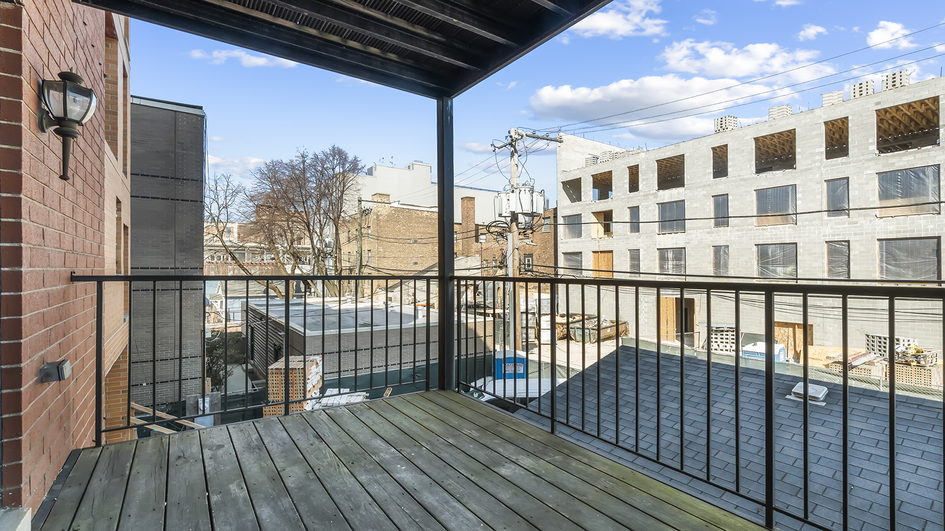912 West Fletcher Street, Unit 2 Chicago, IL 60657 - Photo 27 of 29 a view of a balcony with wooden floor