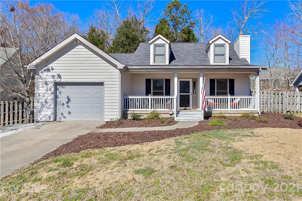 168 Sea Island Boulevard, Unit 26 Fort Mill, SC 29708 - Photo 1 of 17 a view of the house with small yard and garage