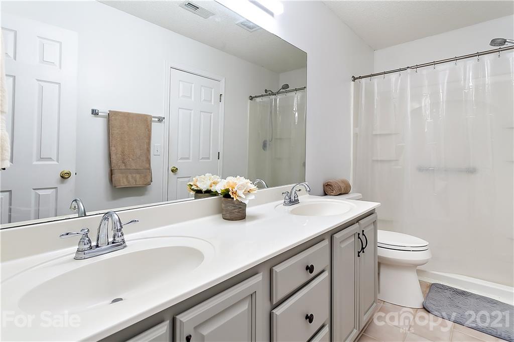 168 Sea Island Boulevard, Unit 26 Fort Mill, SC 29708 - Photo 14 of 17 a bathroom with double sink and a mirror