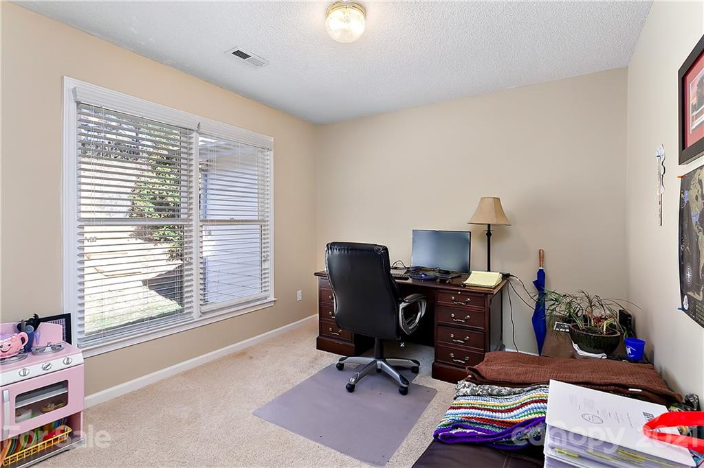 168 Sea Island Boulevard, Unit 26 Fort Mill, SC 29708 - Photo 16 of 17 a view of a workspace with furniture and a window