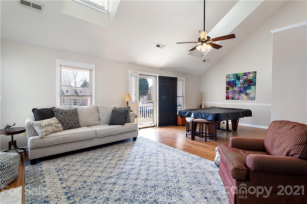 168 Sea Island Boulevard, Unit 26 Fort Mill, SC 29708 - Photo 5 of 17 a living room with furniture a ceiling fan and a rug