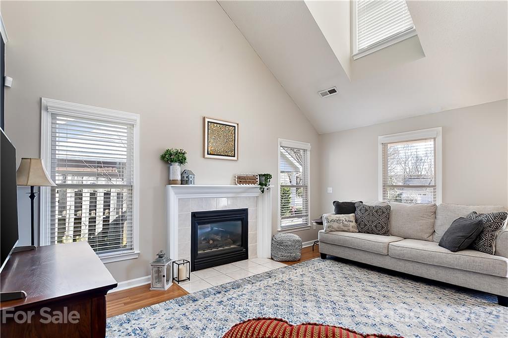 168 Sea Island Boulevard, Unit 26 Fort Mill, SC 29708 - Photo 6 of 17 a living room with furniture and a fireplace