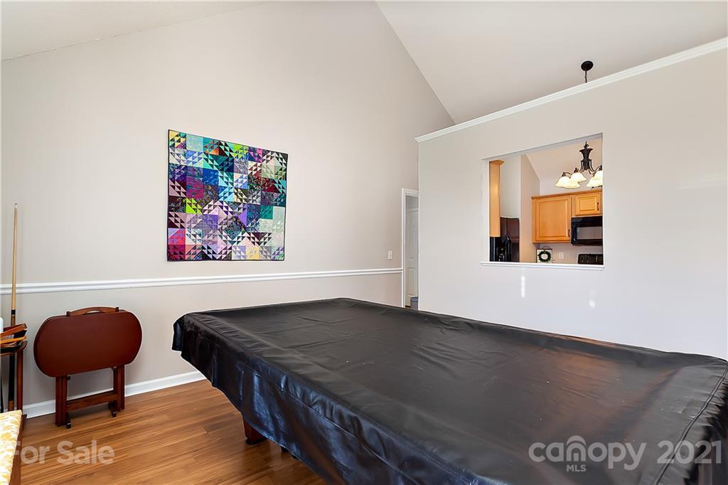 168 Sea Island Boulevard, Unit 26 Fort Mill, SC 29708 - Photo 8 of 17 a living room with furniture and a chair