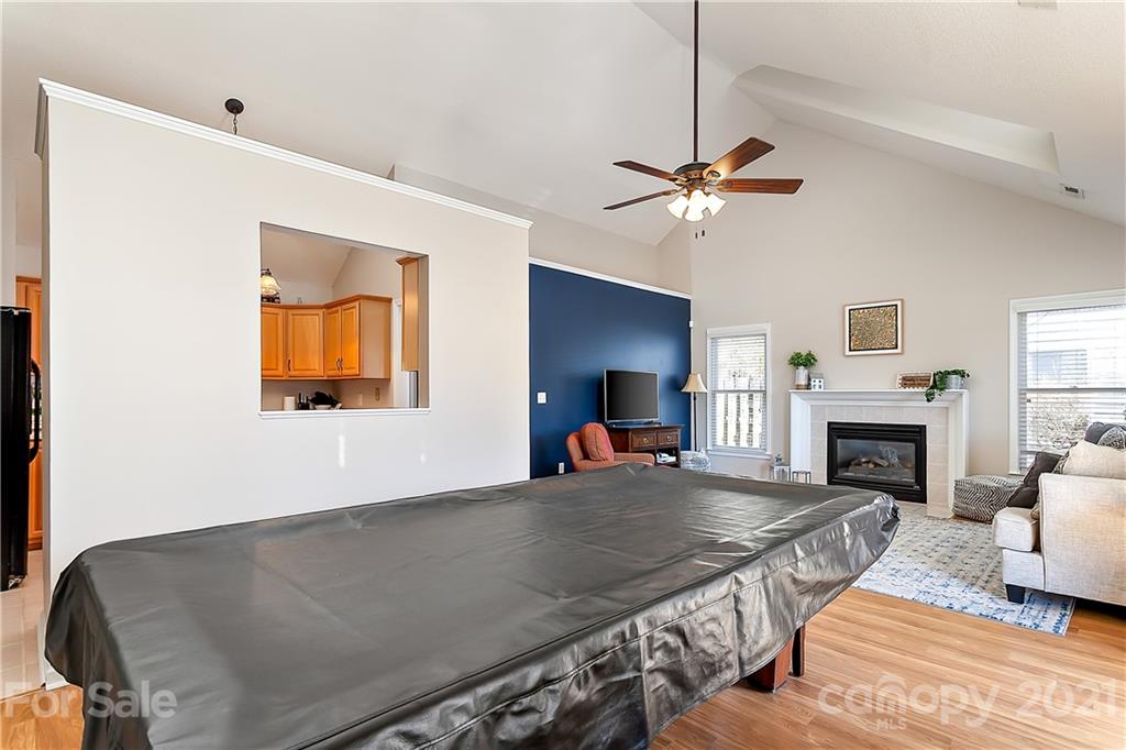 168 Sea Island Boulevard, Unit 26 Fort Mill, SC 29708 - Photo 9 of 17 a living room with furniture and a fireplace