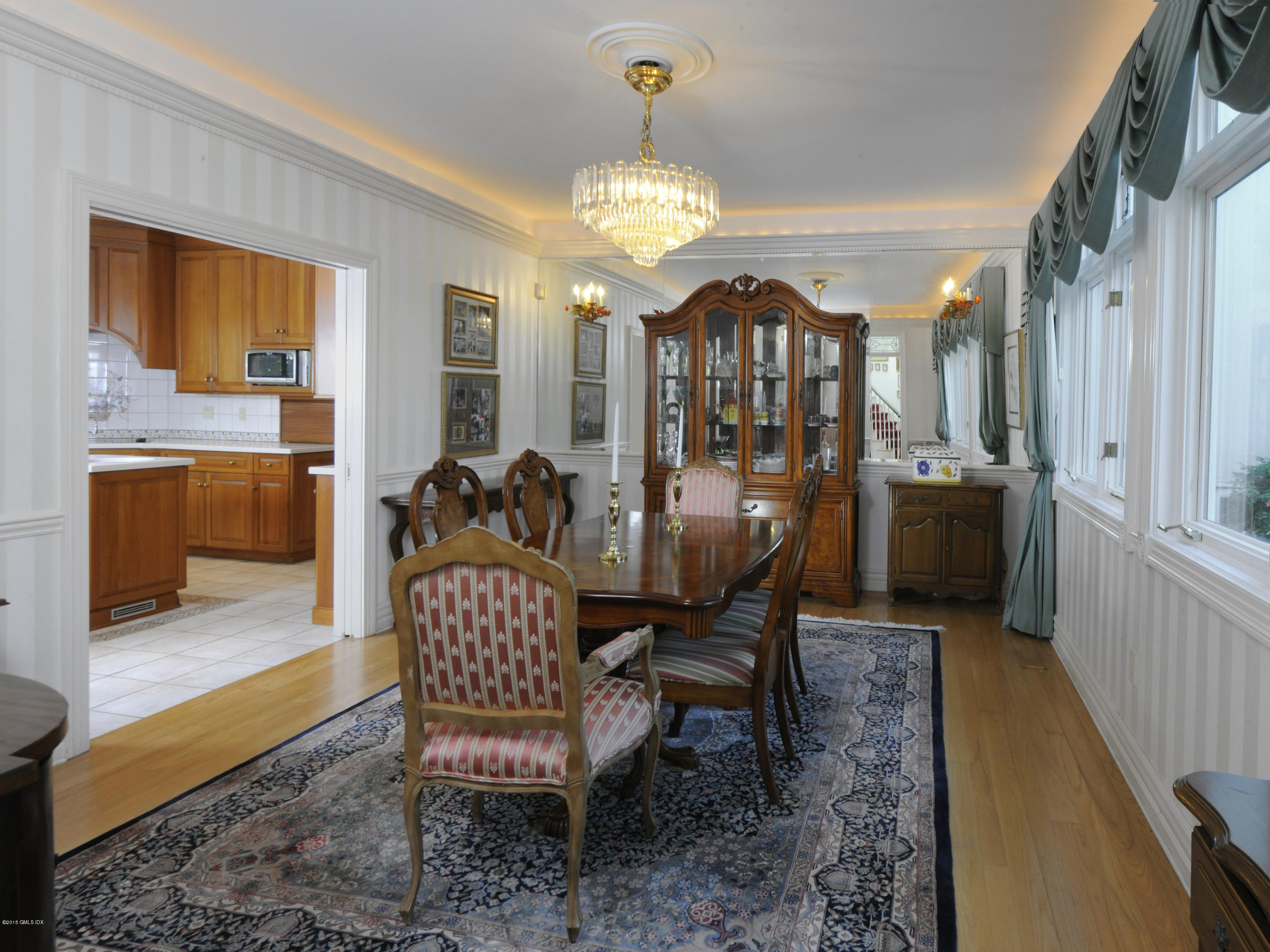 71 Byram Shore Road Greenwich, CT 06830 - Photo 15 of 32 a view of a dining room with furniture and chandelier