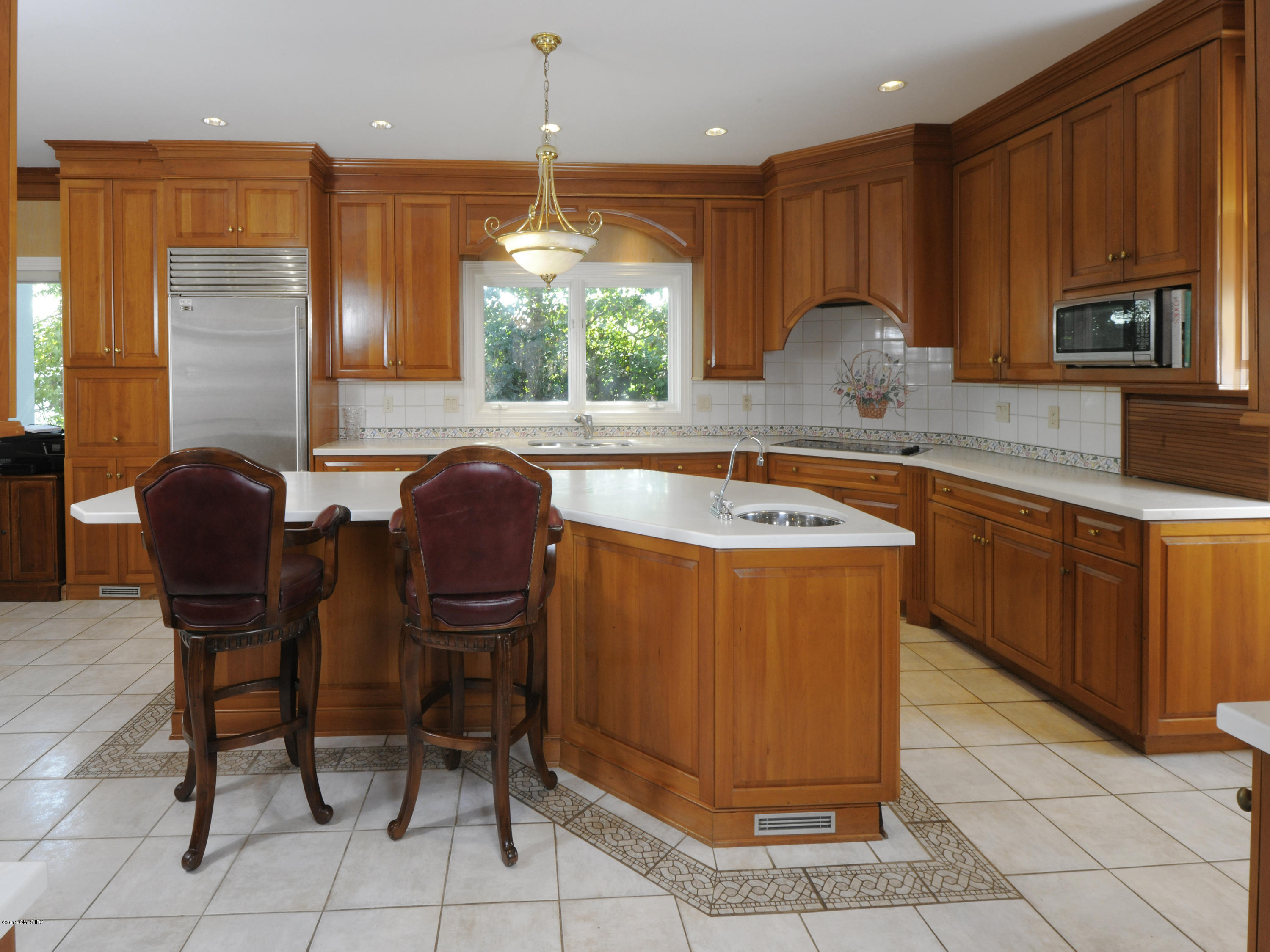 71 Byram Shore Road Greenwich, CT 06830 - Photo 18 of 32 a kitchen with stainless steel appliances granite countertop a sink counter space and chair