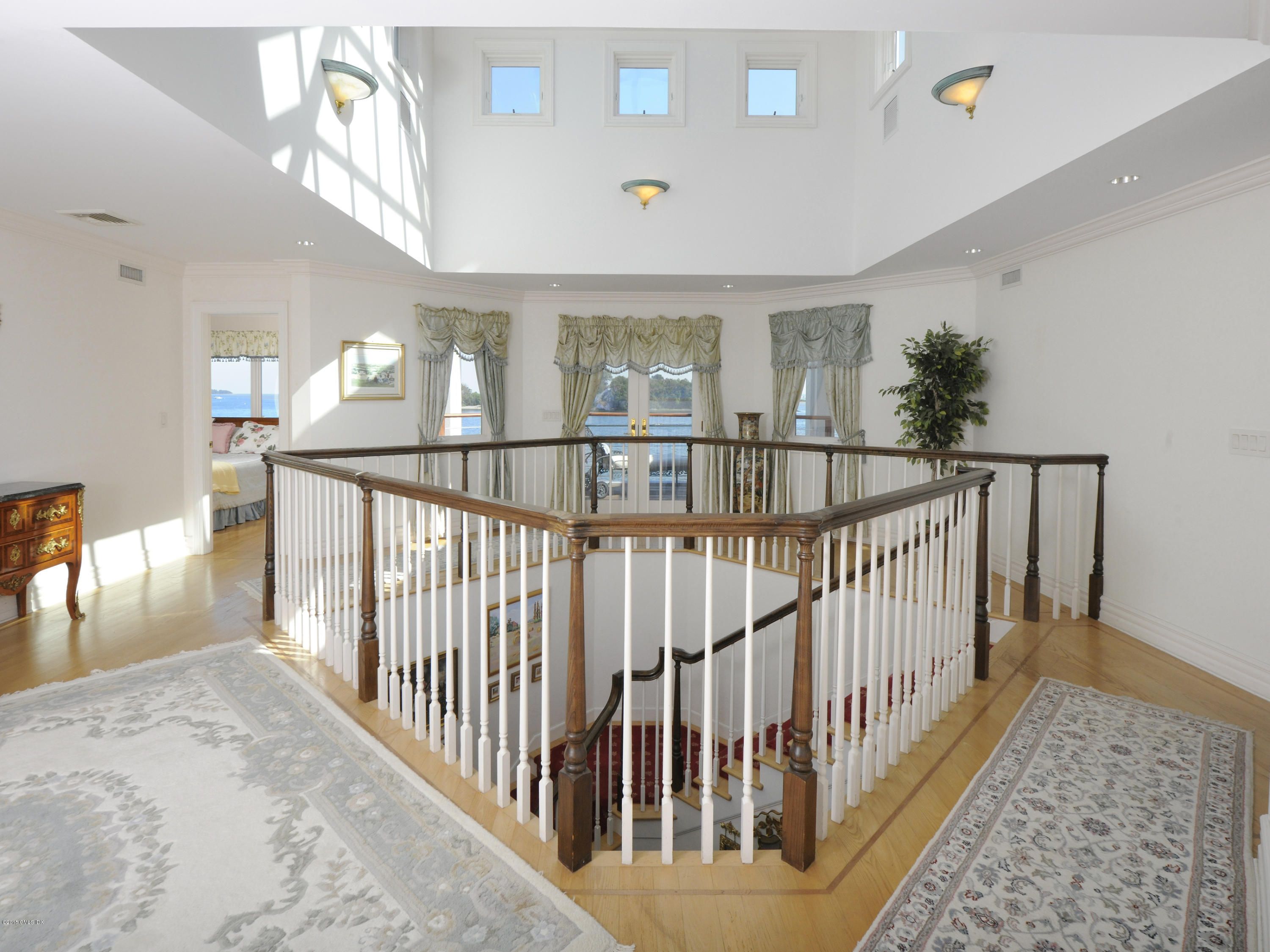 71 Byram Shore Road Greenwich, CT 06830 - Photo 19 of 32 a view of staircase with railing and a rug