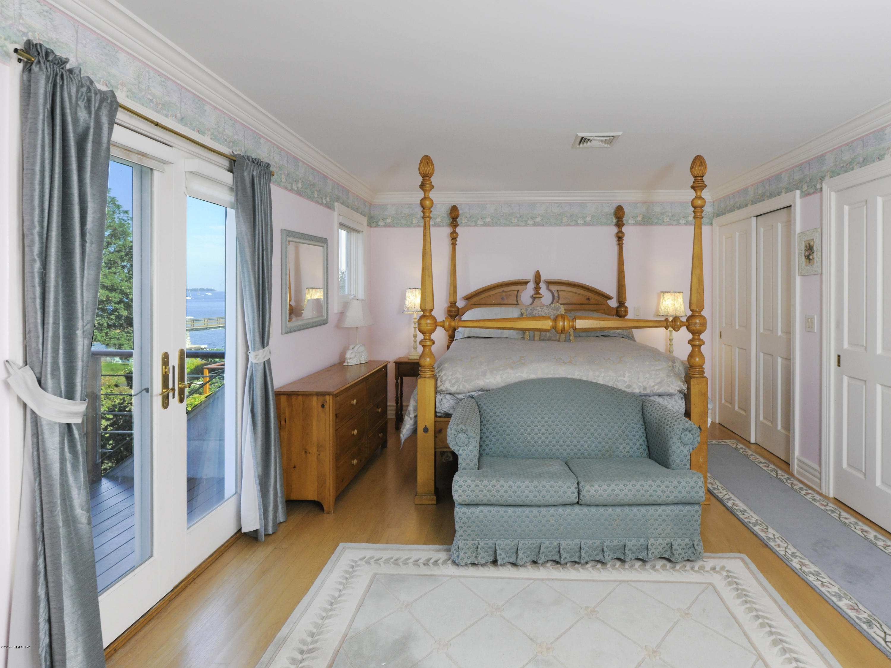 71 Byram Shore Road Greenwich, CT 06830 - Photo 23 of 32 a living room with a fireplace furniture and a rug