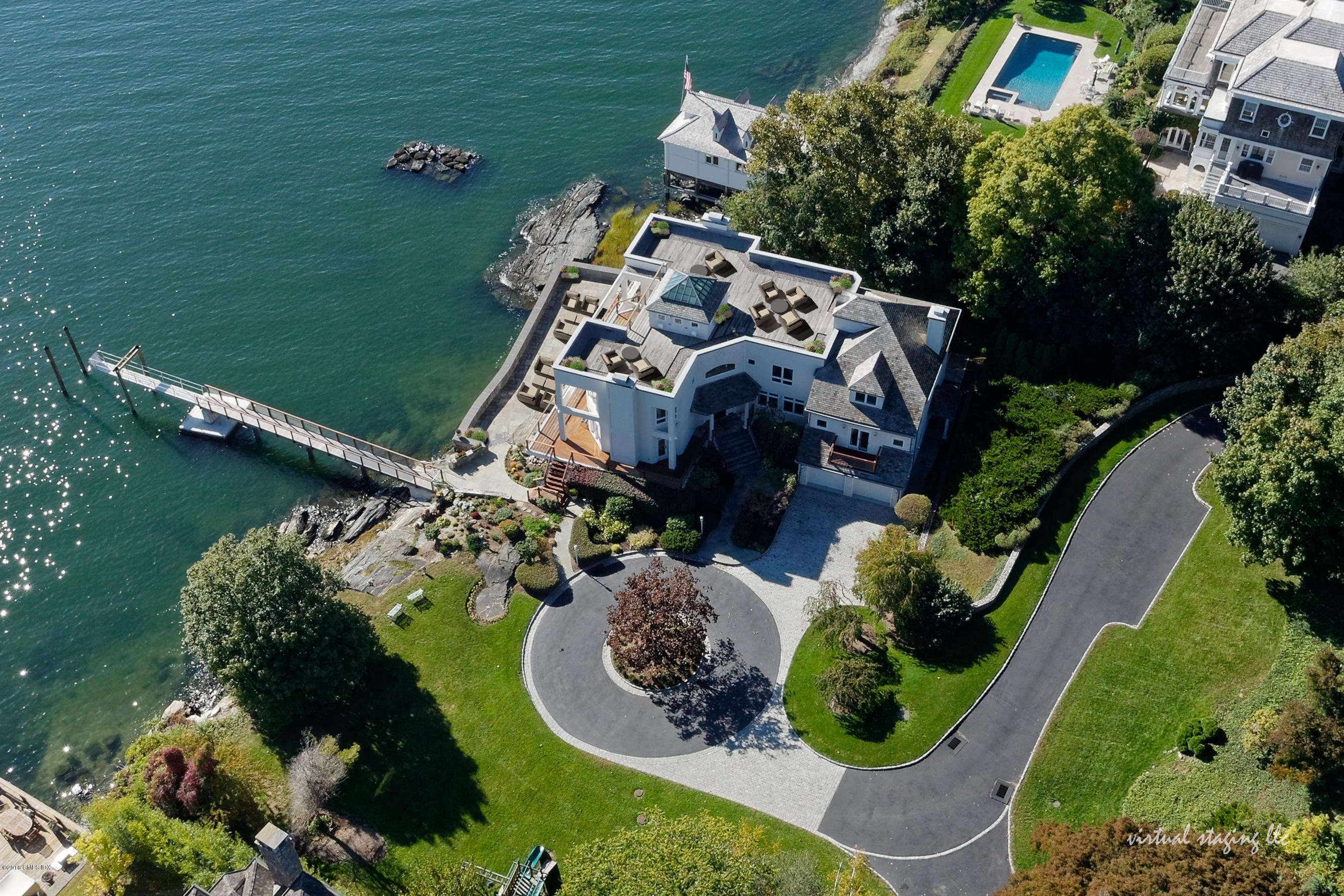 71 Byram Shore Road Greenwich, CT 06830 - Photo 4 of 32 a view of a lake with a house