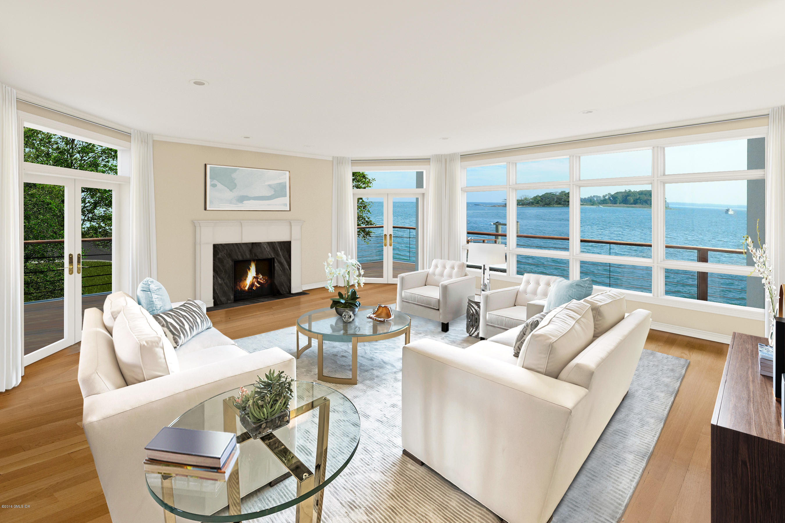 71 Byram Shore Road Greenwich, CT 06830 - Photo 10 of 32 a living room with furniture a fireplace and a large window