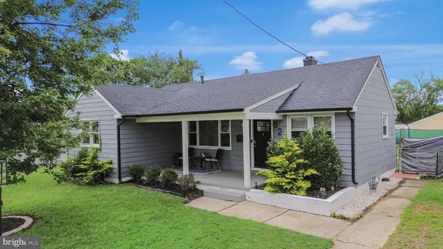 a view of a house with a garden and plants
