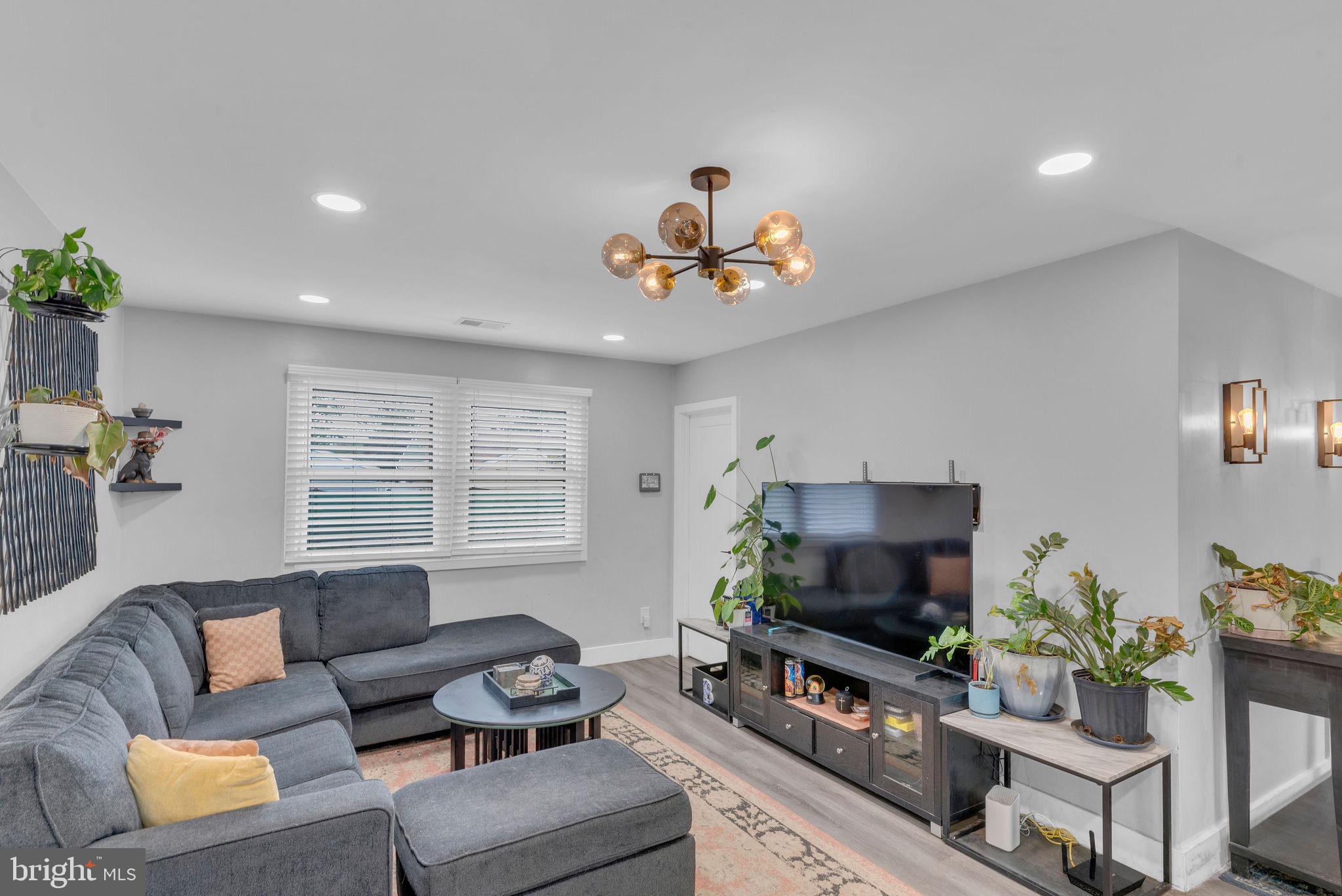 629 Polk Street Riverside, NJ 08075 - Photo 13 of 42 a living room with furniture and a flat screen tv