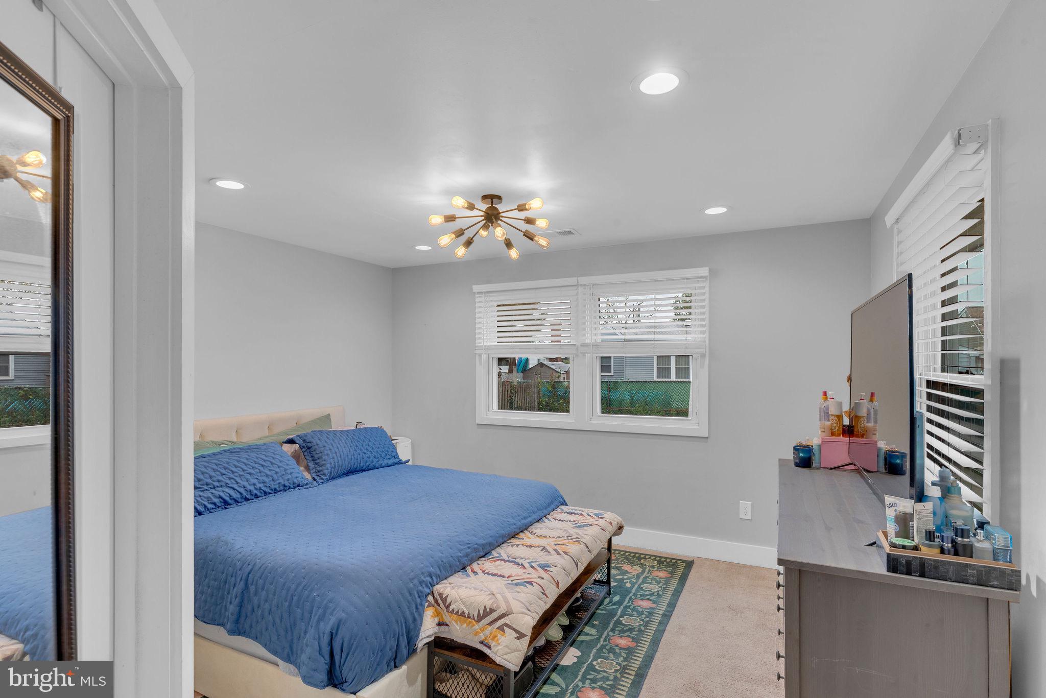 629 Polk Street Riverside, NJ 08075 - Photo 21 of 42 a living room with furniture and a chandelier