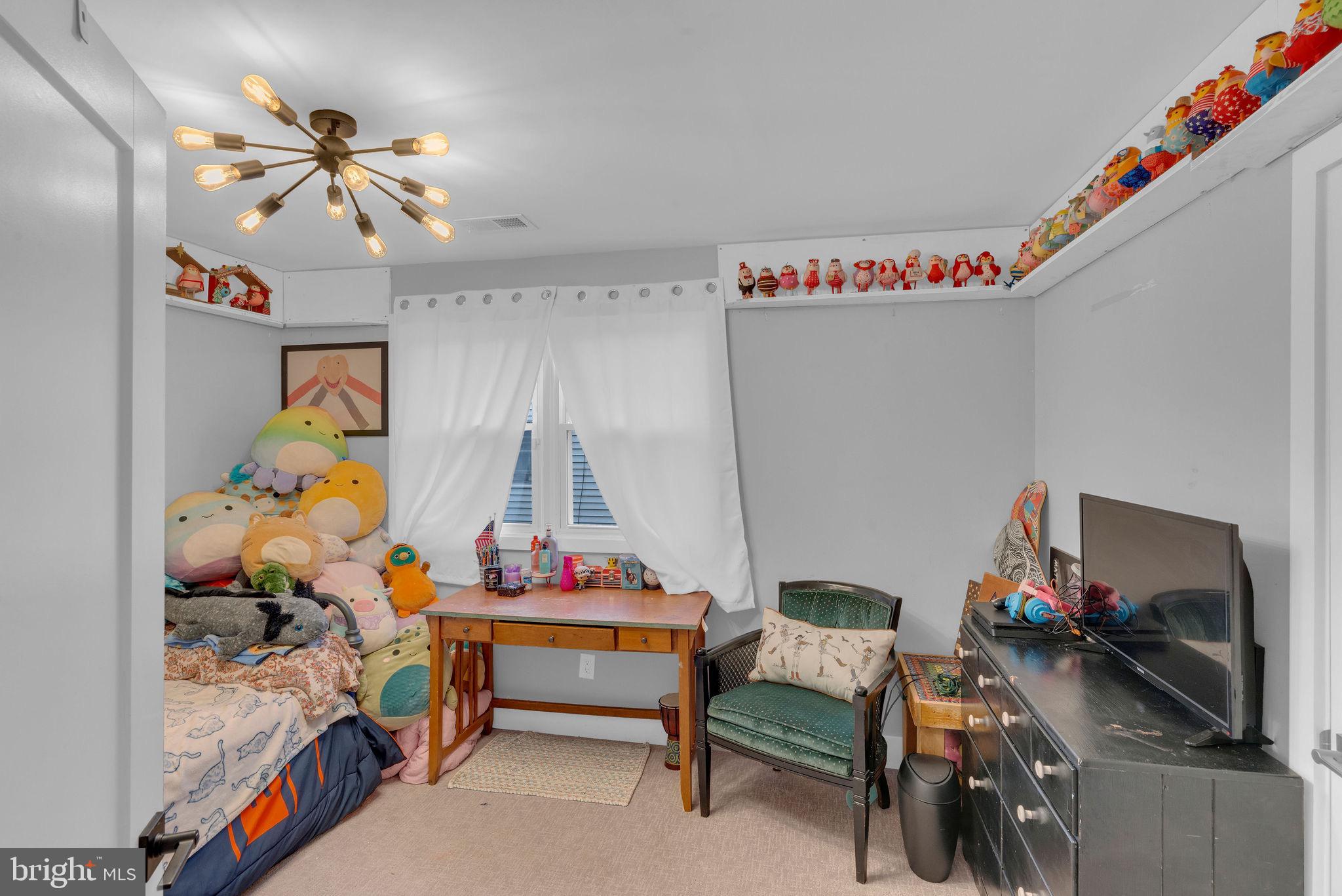 629 Polk Street Riverside, NJ 08075 - Photo 25 of 42 a bedroom with bed and a chandelier