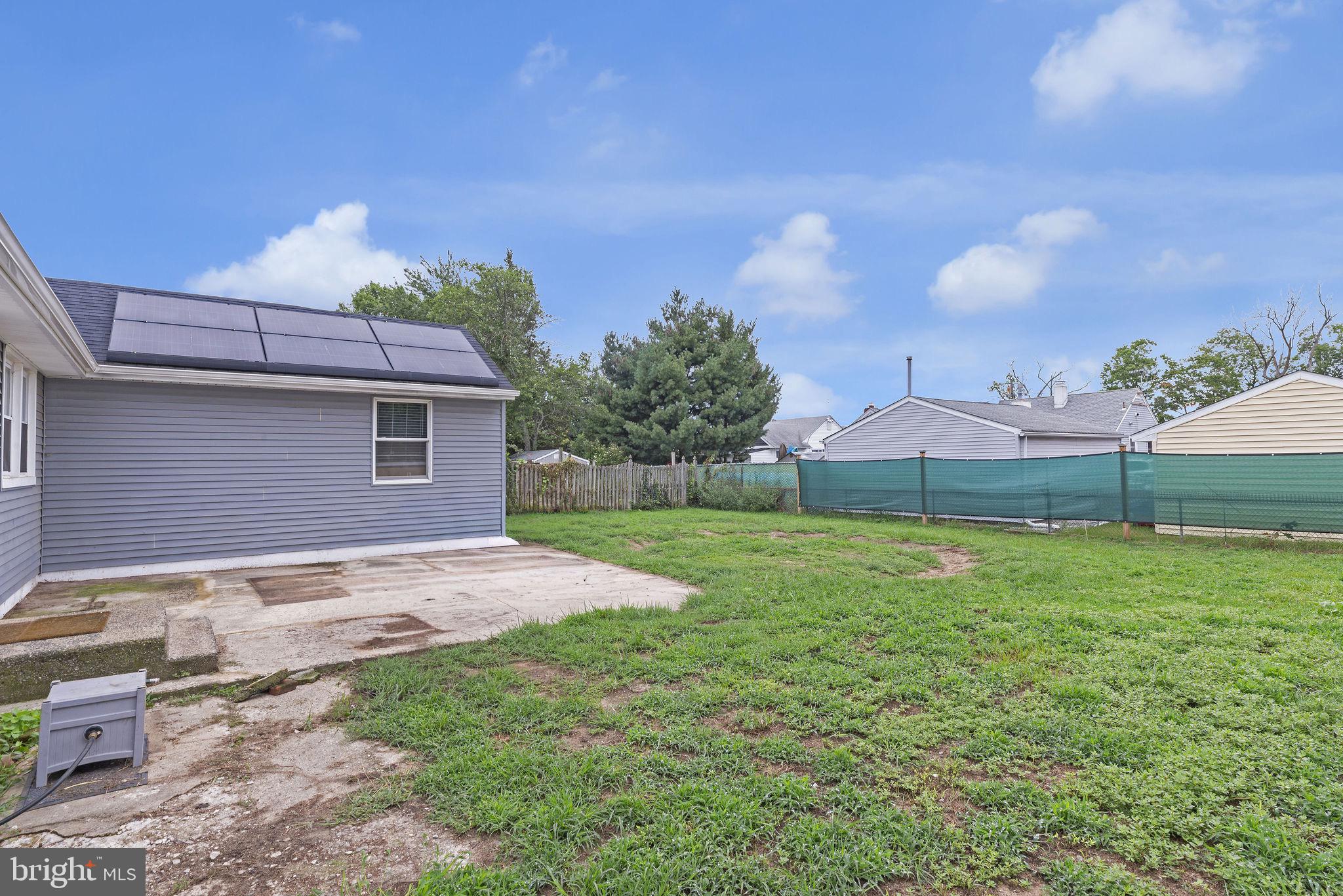 629 Polk Street Riverside, NJ 08075 - Photo 27 of 42 a backyard of a house with table and chairs