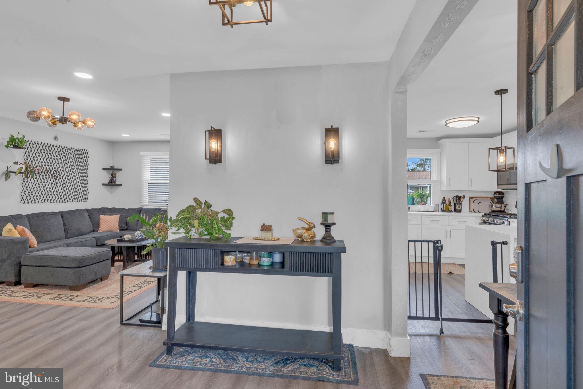 629 Polk Street Riverside, NJ 08075 - Photo 5 of 42 a living room with furniture and a refrigerator