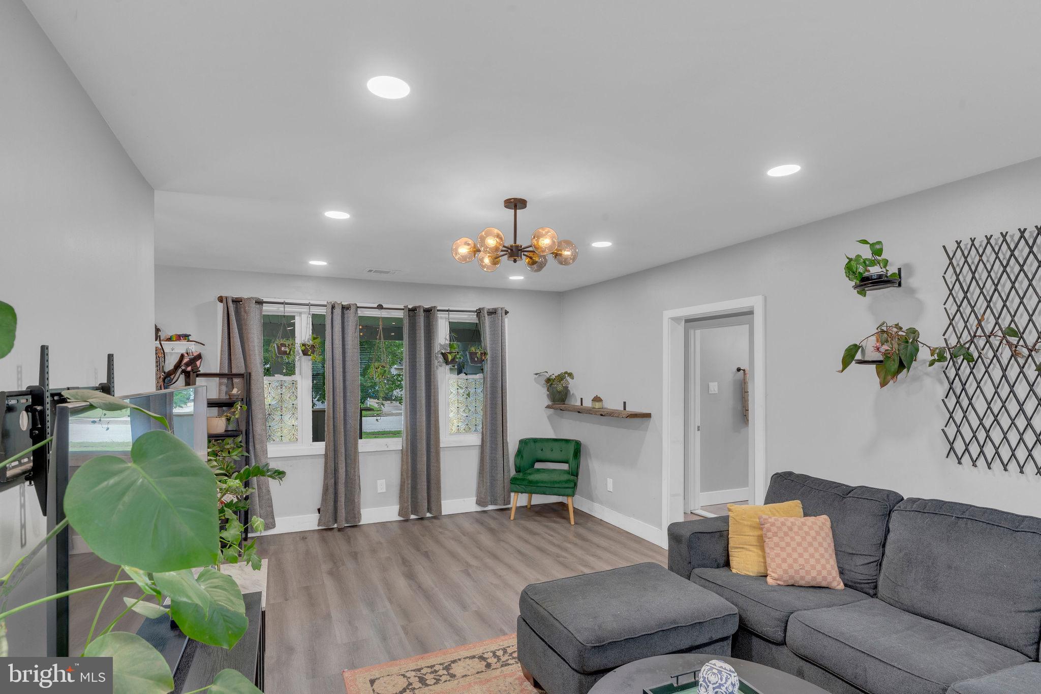 629 Polk Street Riverside, NJ 08075 - Photo 7 of 42 a living room with furniture and a chandelier