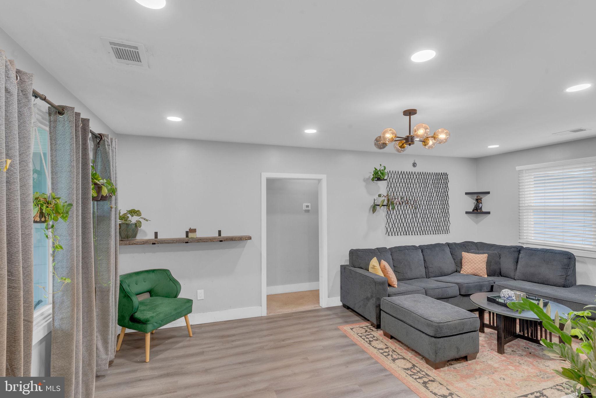 629 Polk Street Riverside, NJ 08075 - Photo 8 of 42 a living room with furniture and a wooden floor