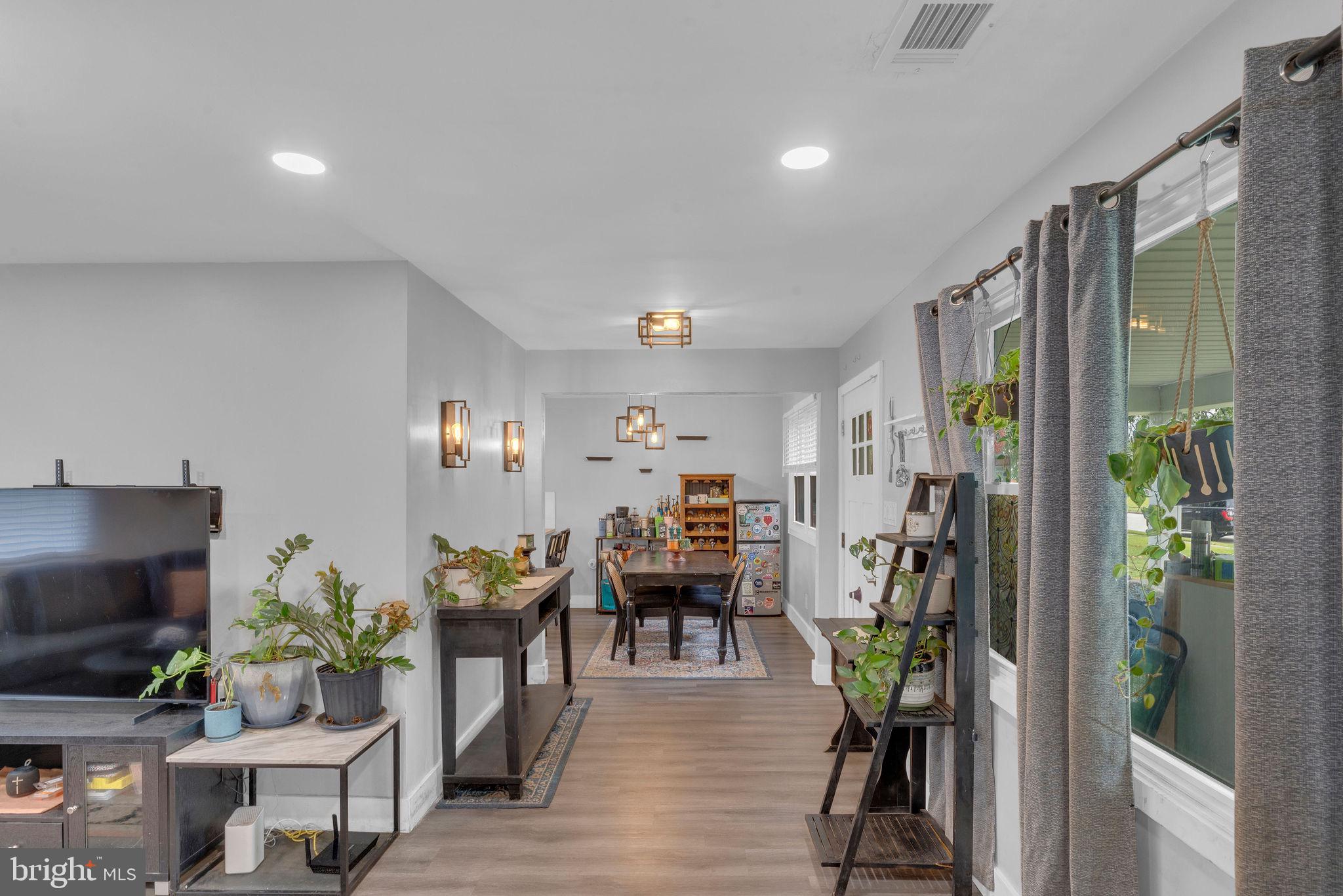 629 Polk Street Riverside, NJ 08075 - Photo 9 of 42 a living room with furniture and a flat screen tv