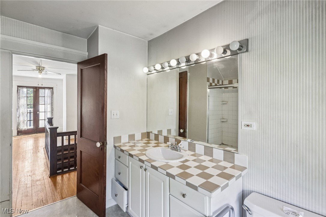 4040 Bayard Road Cleveland, OH 44121 - Photo 36 of 49 Full bathroom with vanity, french doors, a shower with shower door, and ceiling fan