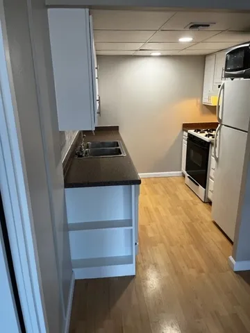 a kitchen with a stove and a refrigerator