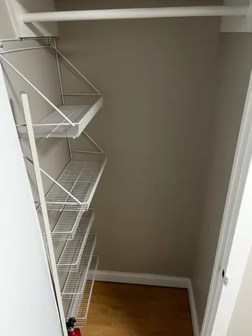 a view of kitchen with wooden floor and a window