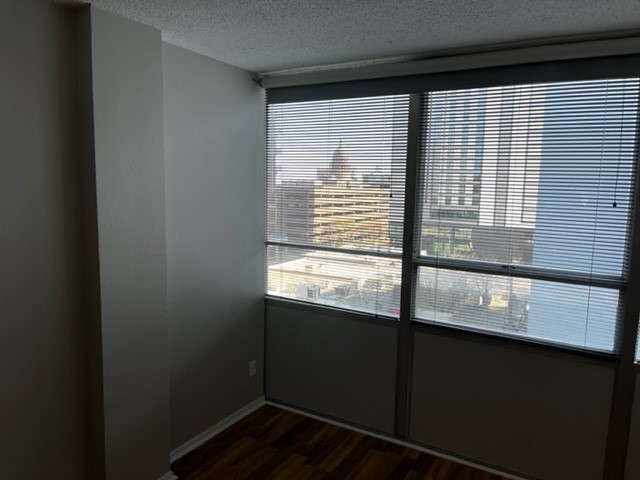 1800 Lavaca Street, Unit 607 Austin, TX 78701 - Photo 21 of 22 a view of kitchen with wooden floor and a window