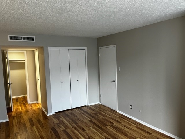 1800 Lavaca Street, Unit 607 Austin, TX 78701 - Photo 4 of 22 a view of room with window and wooden floor