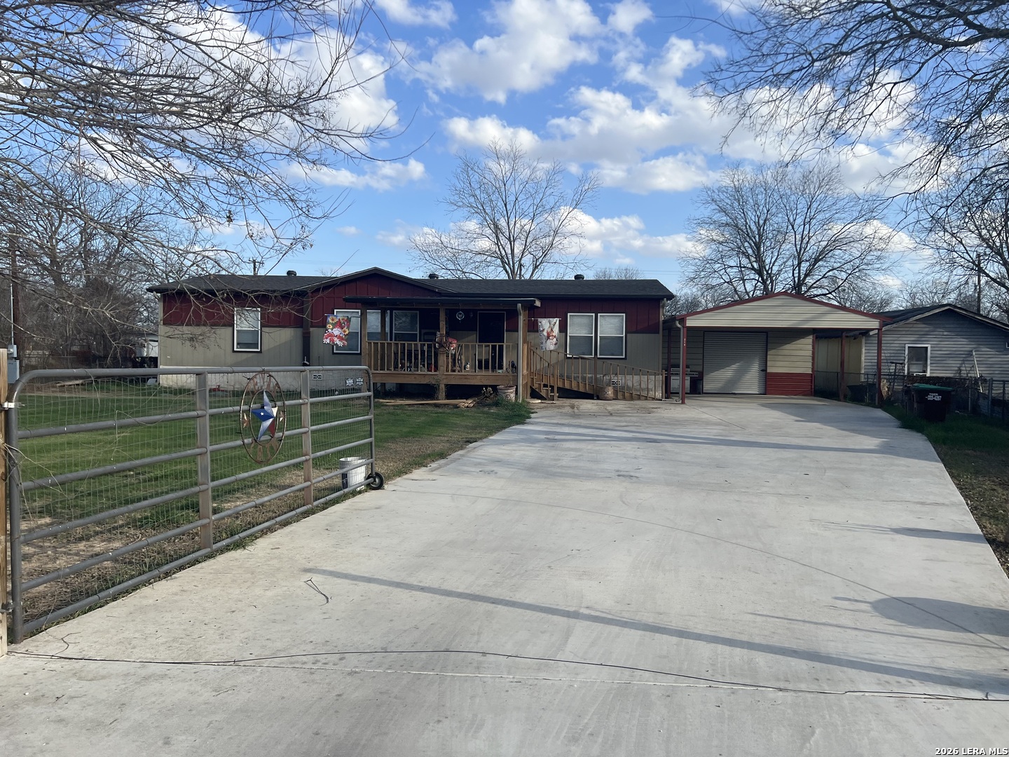 218 West 2nd Street Elmendorf, TX 78112 - Photo 1 of 13 a front view of a house with a yard