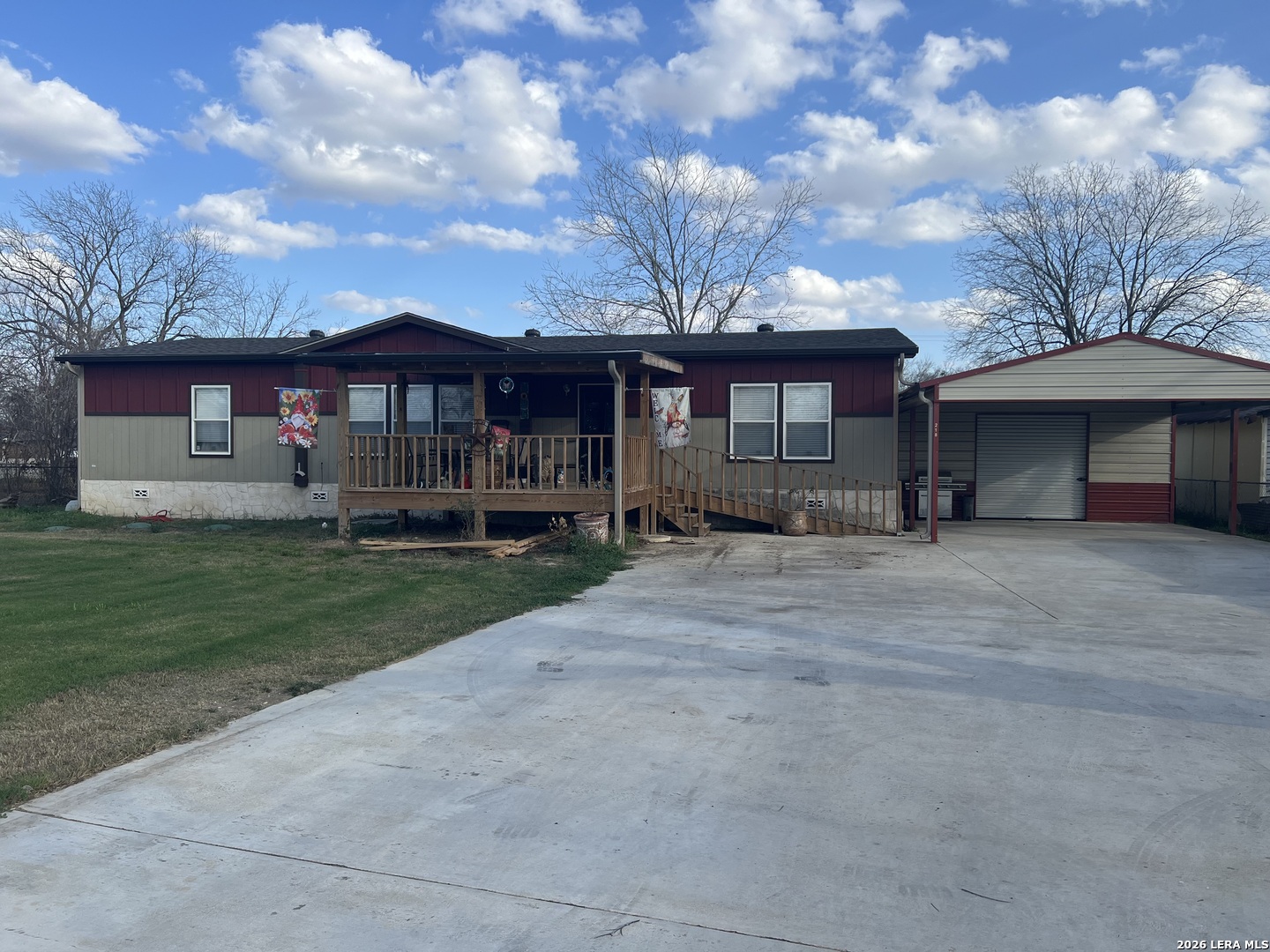 218 West 2nd Street Elmendorf, TX 78112 - Photo 2 of 13 a front view of a house with a garden