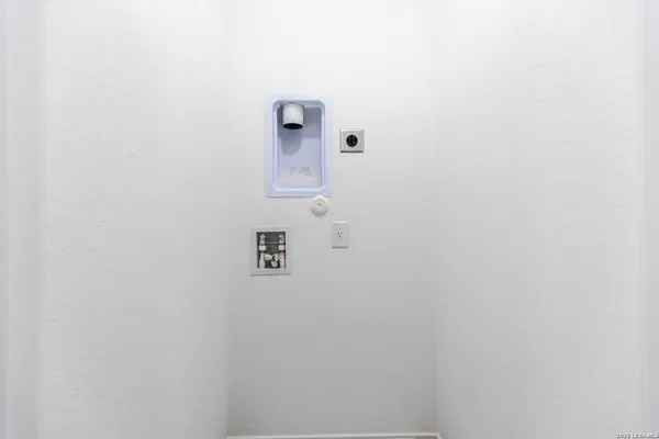 a bathroom with a sink mirror and toilet