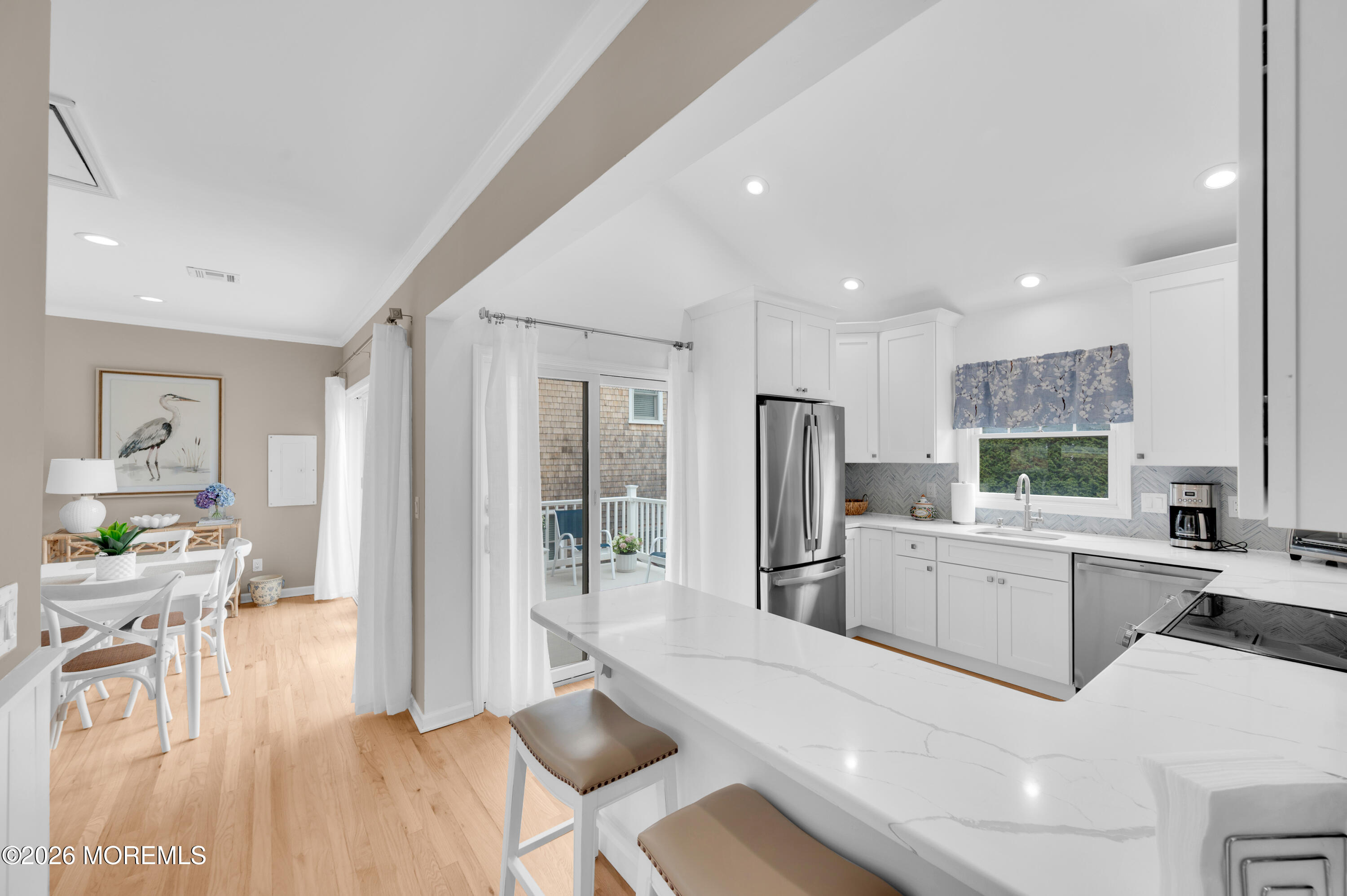 41 A Mount Street Bay Head, NJ 08742 - Photo 7 of 33 a kitchen with refrigerator a sink and chairs