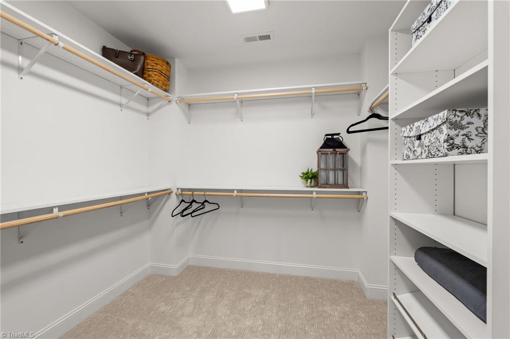 8419 Pheasant Ridge Drive Colfax, NC 27235 - Photo 31 of 49 This closet is to die for!! Love all the wooden shelving!